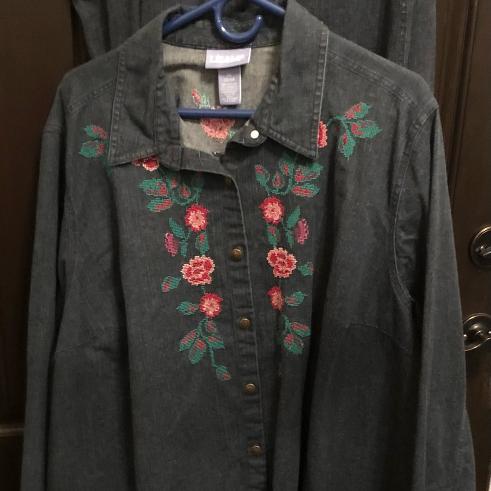 Darker denim skirt and blouse ensemble with embroidered rose design.